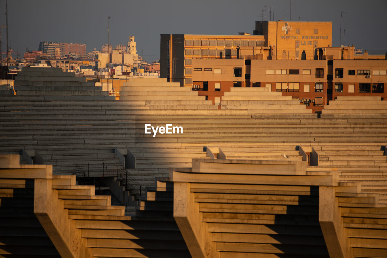 High angle view of steps amidst buildings in city