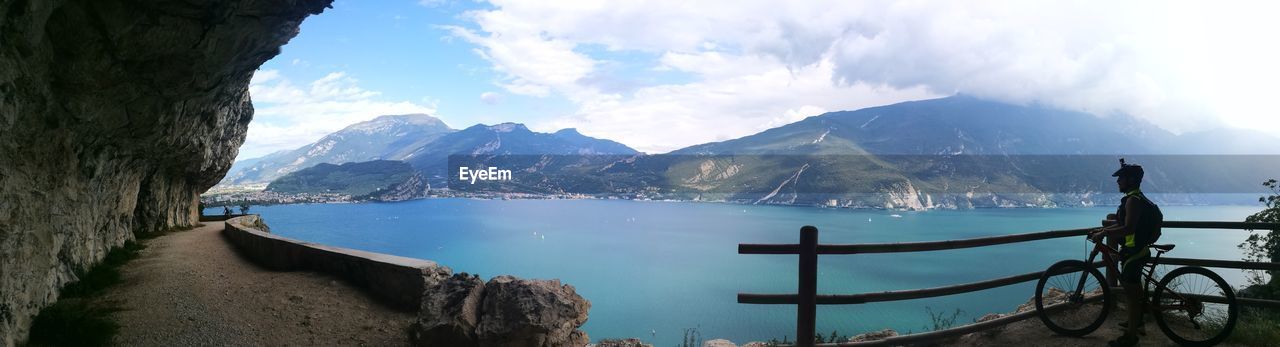 PANORAMIC SHOT OF LAKE BY MOUNTAINS AGAINST SKY