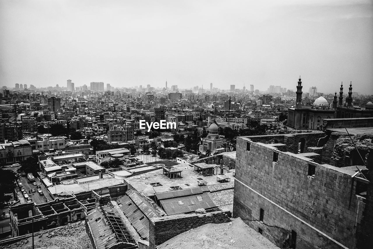 Scenic view of town against clear sky