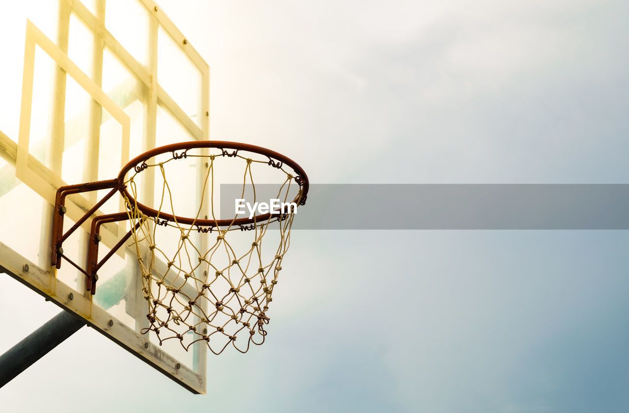 Low angle view of basketball hoop against sky