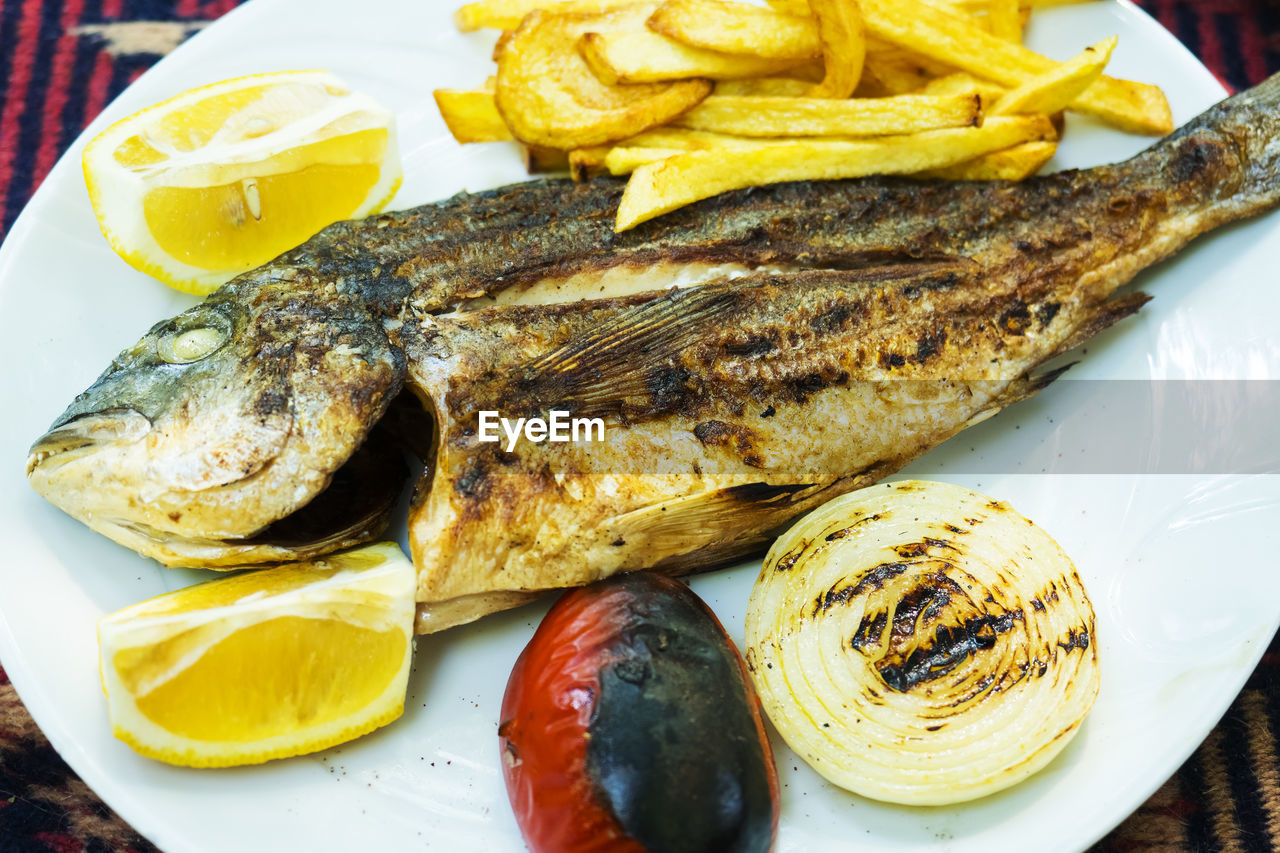 High angle view of freed fish served on plate