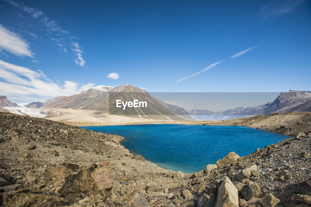 Glacially fed moraine lake in akshayak pass, baffin island.