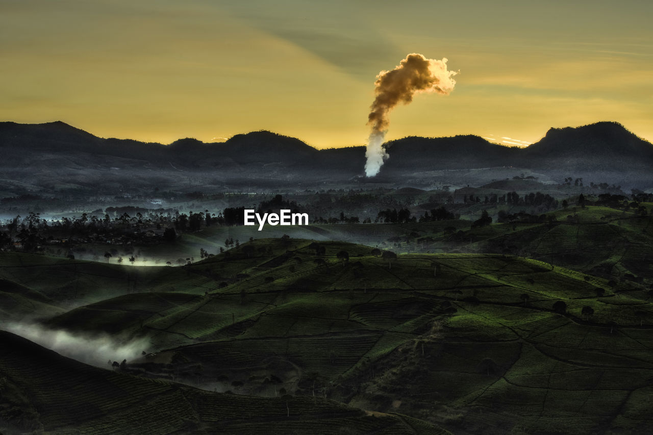 Scenic view of landscape against sky during sunset