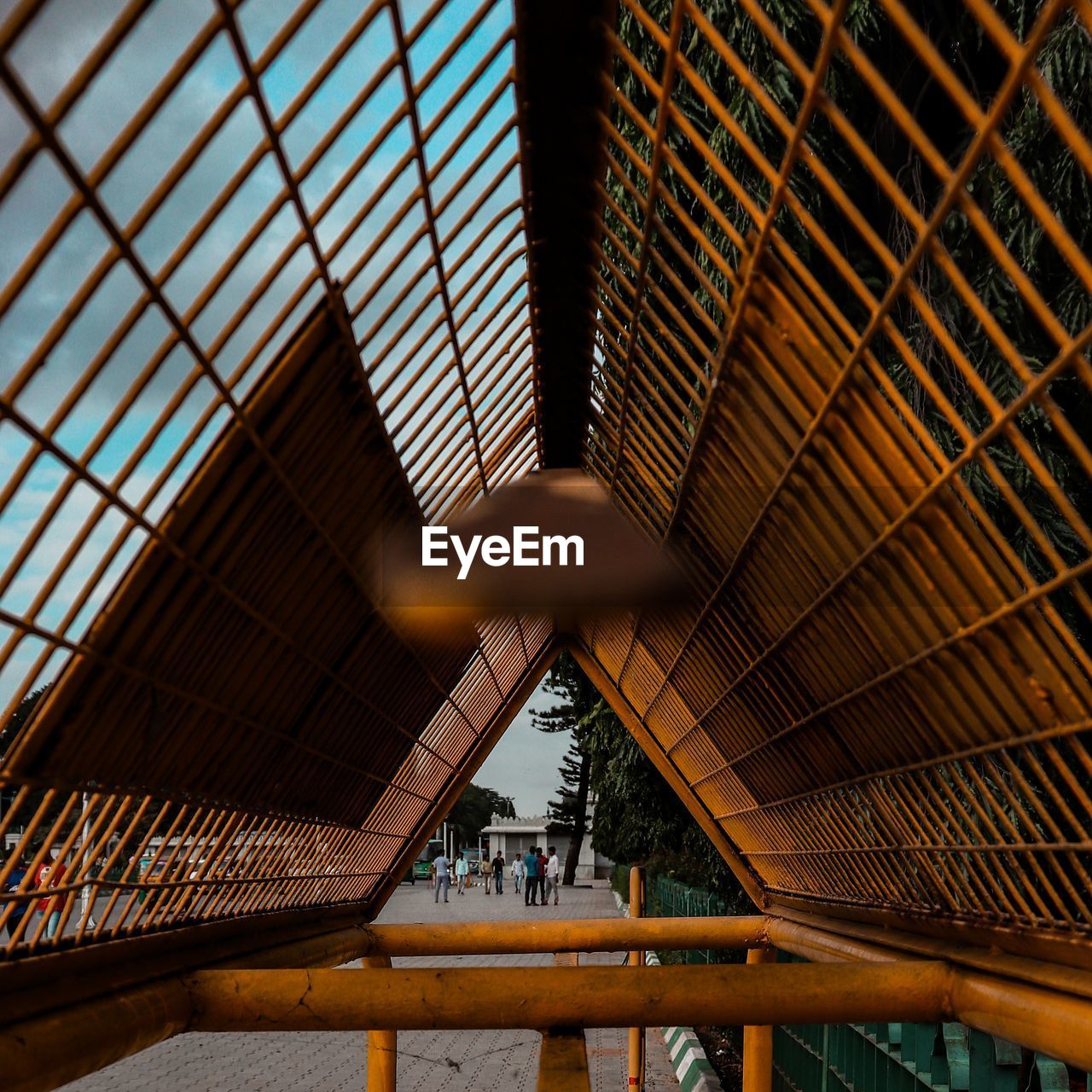 Low angle view of people on ceiling in building