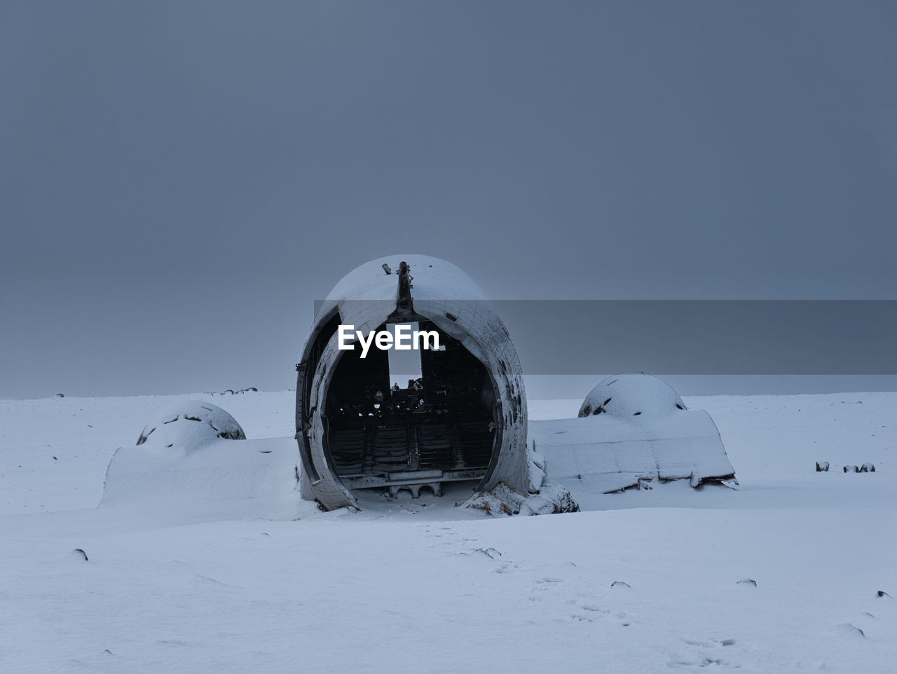 SNOW COVERED FIELD AGAINST SKY DURING WINTER