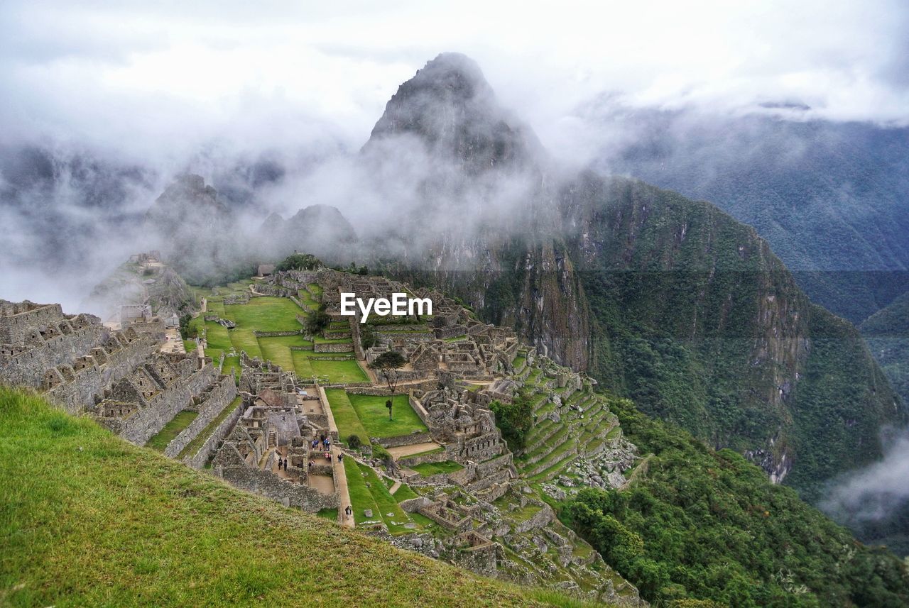 View of old ruins against cloudy sky. machu picchu. 