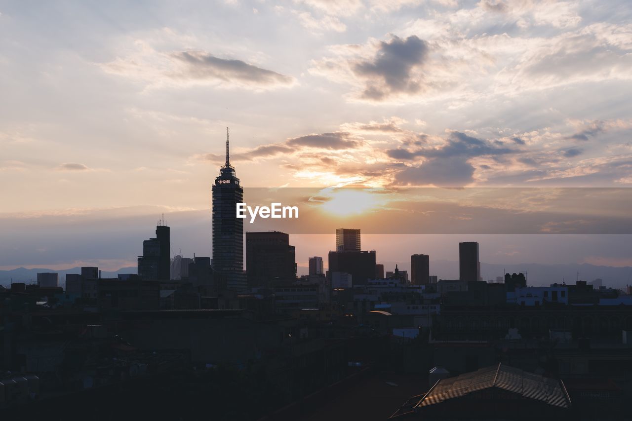 View of cityscape against sky during sunset