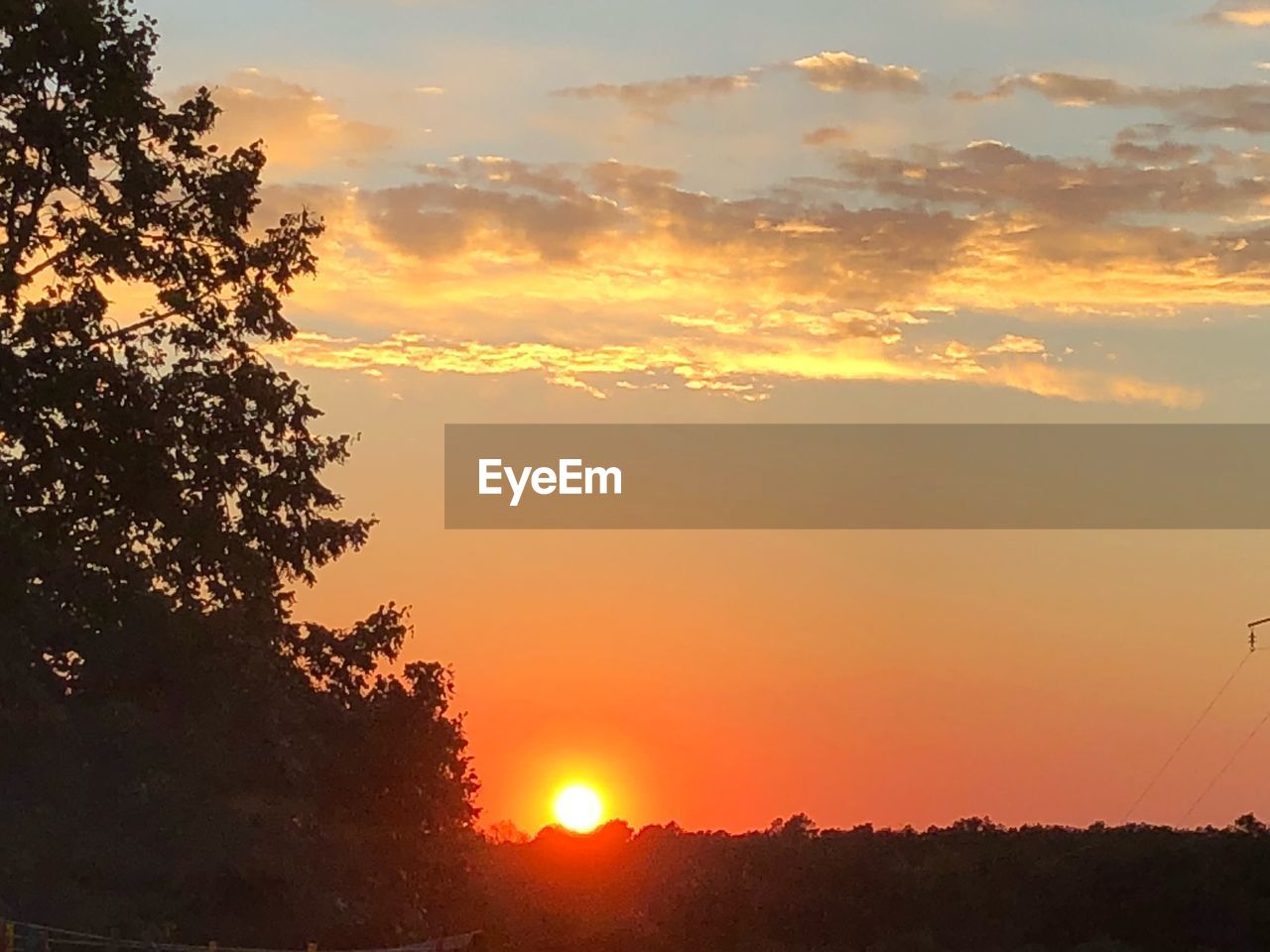 SCENIC VIEW OF SILHOUETTE LANDSCAPE AGAINST SKY DURING SUNSET