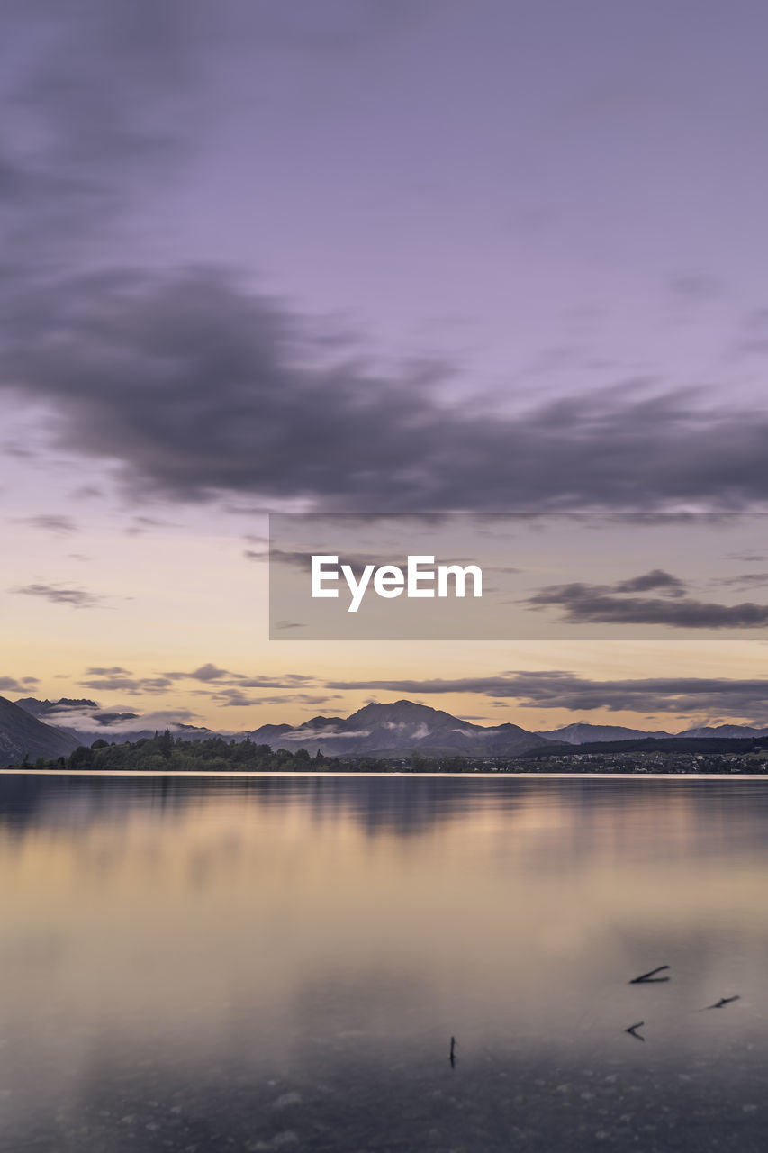 Scenic view of lake against sky during sunset