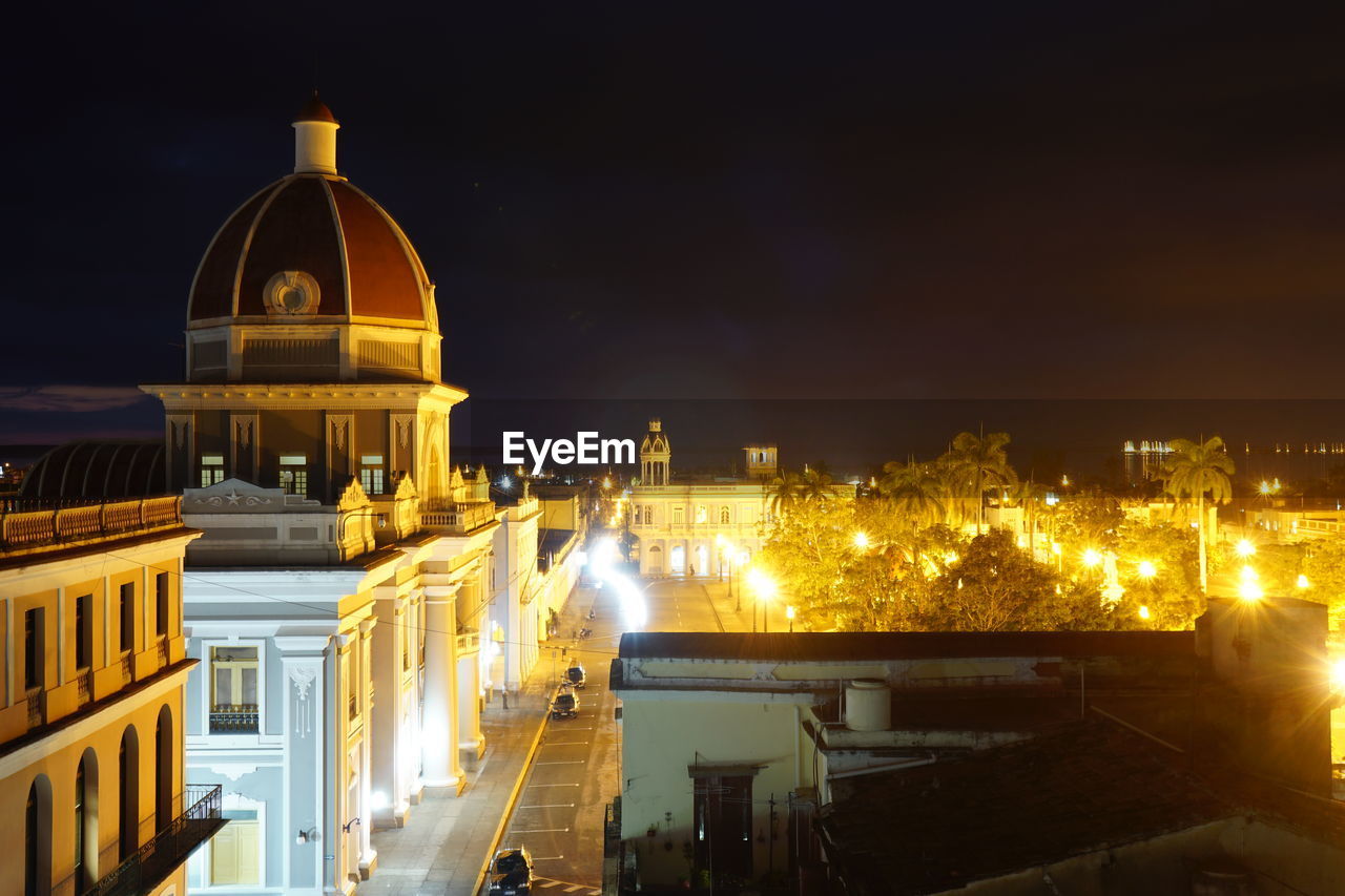 High angle view of illuminated buildings in city at night