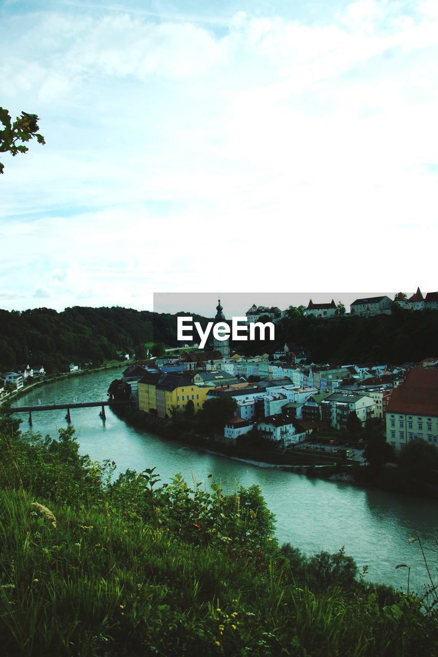 VIEW OF RIVER WITH BUILDINGS IN BACKGROUND