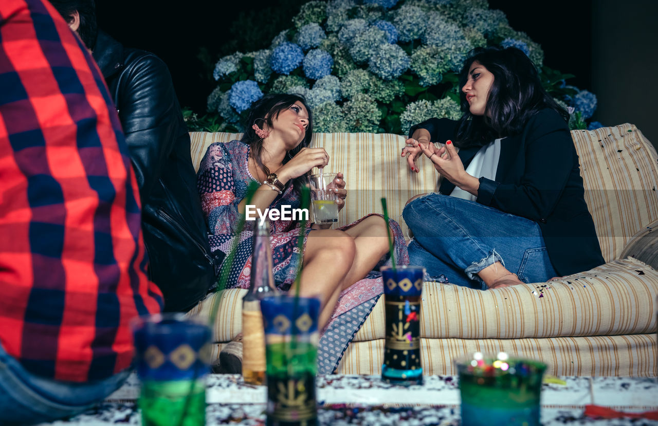 Young friends during party in backyard at night