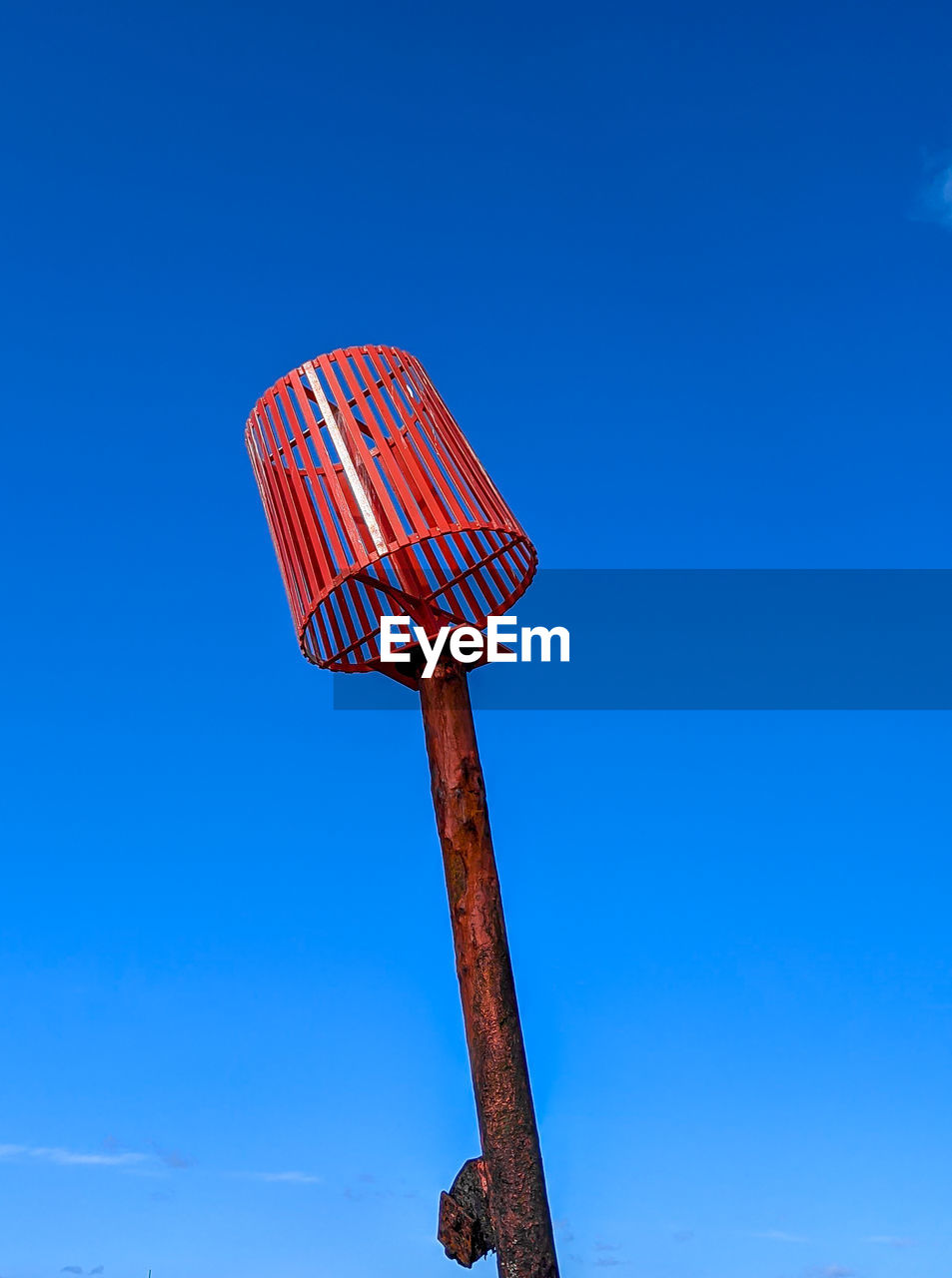 Low angle view of communications tower against clear blue sky beach beacon