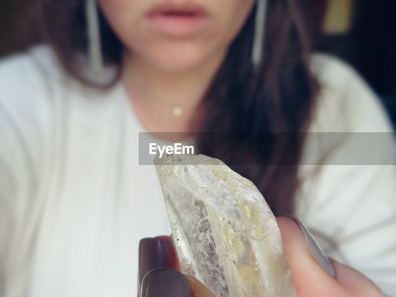 Cropped image of woman holding crystal