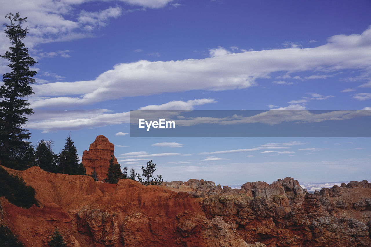 Low angle view of rock formations against sky