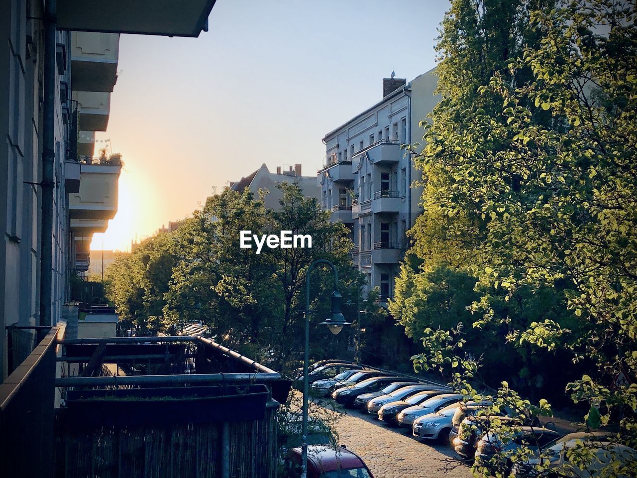 STREET AMIDST BUILDINGS AGAINST SKY