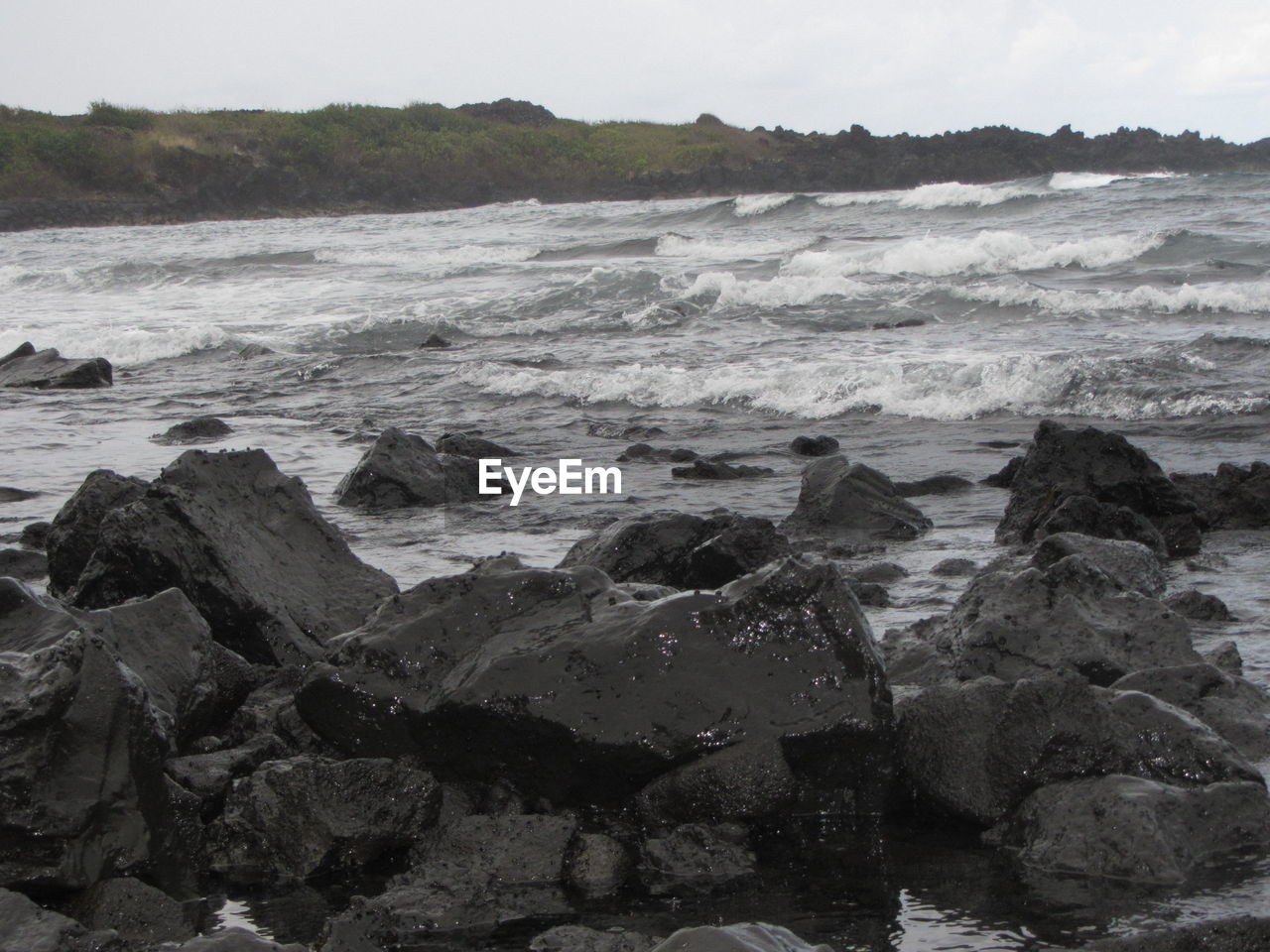 SCENIC VIEW OF ROCKS IN SEA AGAINST SKY