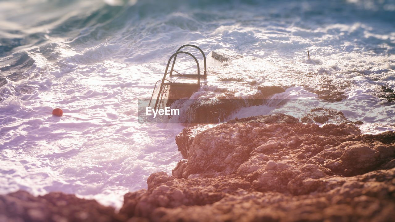 Waves splashing on rocky shore