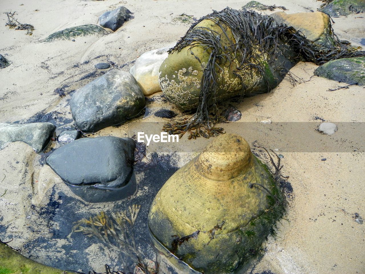 Stones on sandy beach