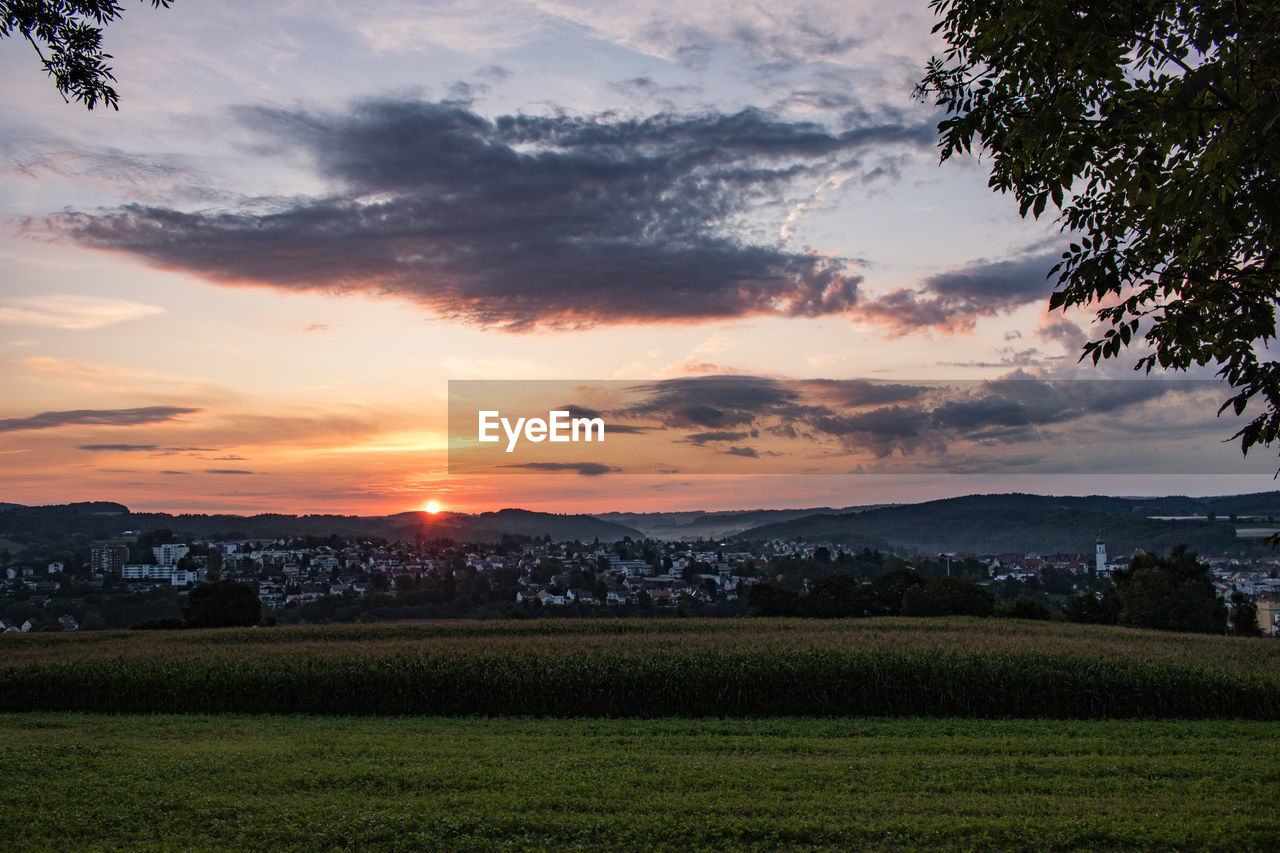 Scenic view of landscape against sky during sunset