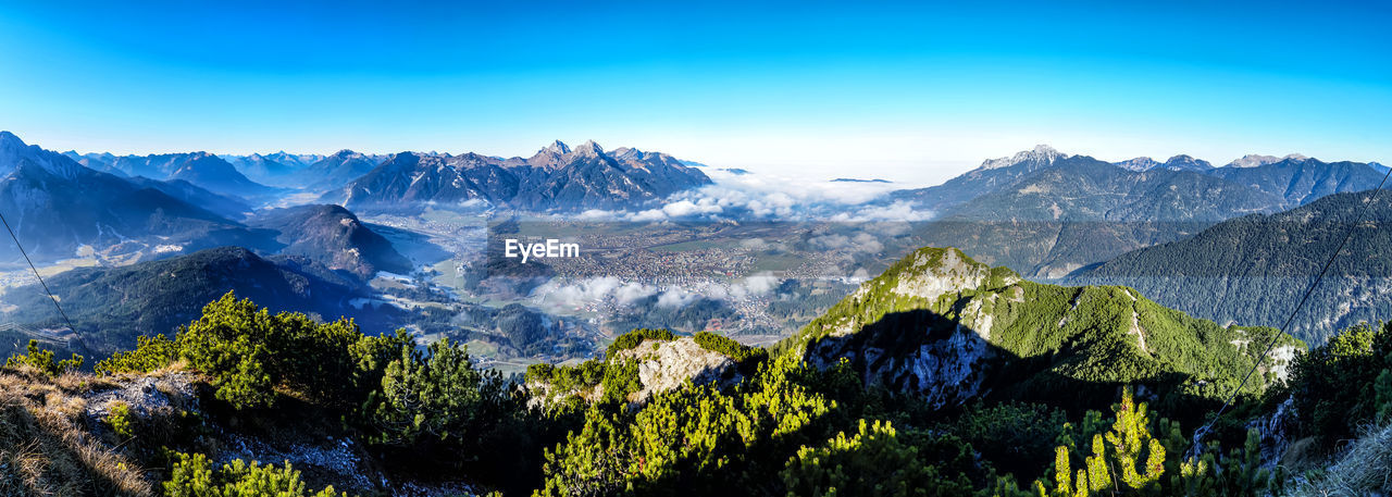 Panoramic view of snowcapped mountains against sky