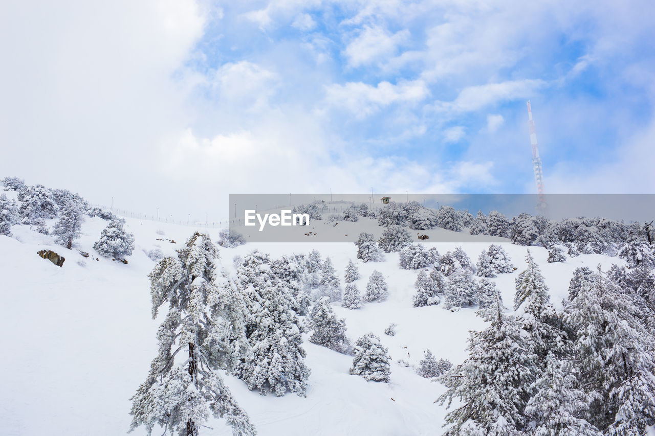panoramic view of snow covered mountain against sky
