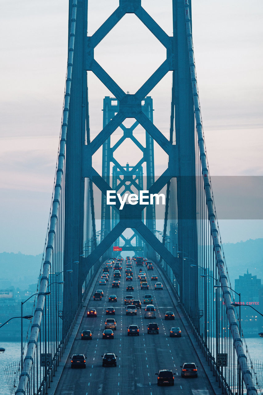 High angle view of suspension bridge over river against sky