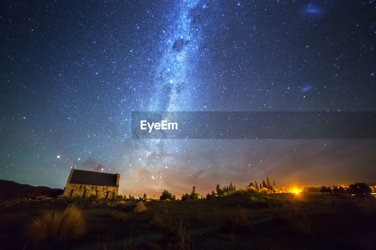 SCENIC VIEW OF ILLUMINATED BUILDING AGAINST SKY