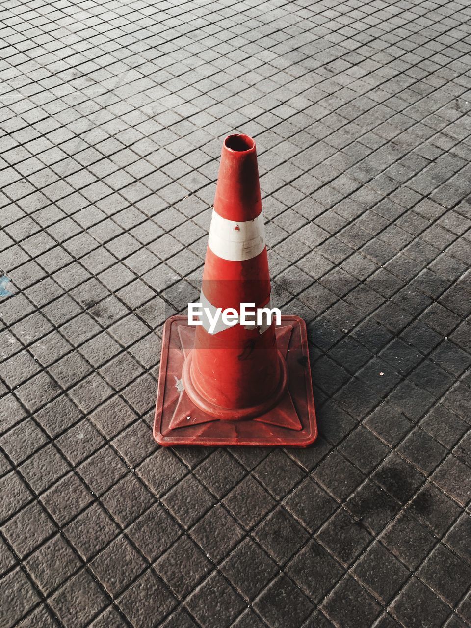 High angle view of traffic cone on footpath