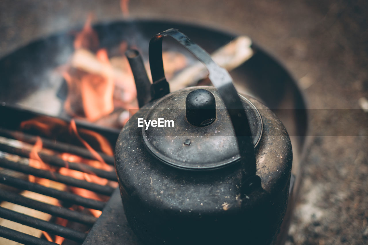 High angle view of teapot on camping stove