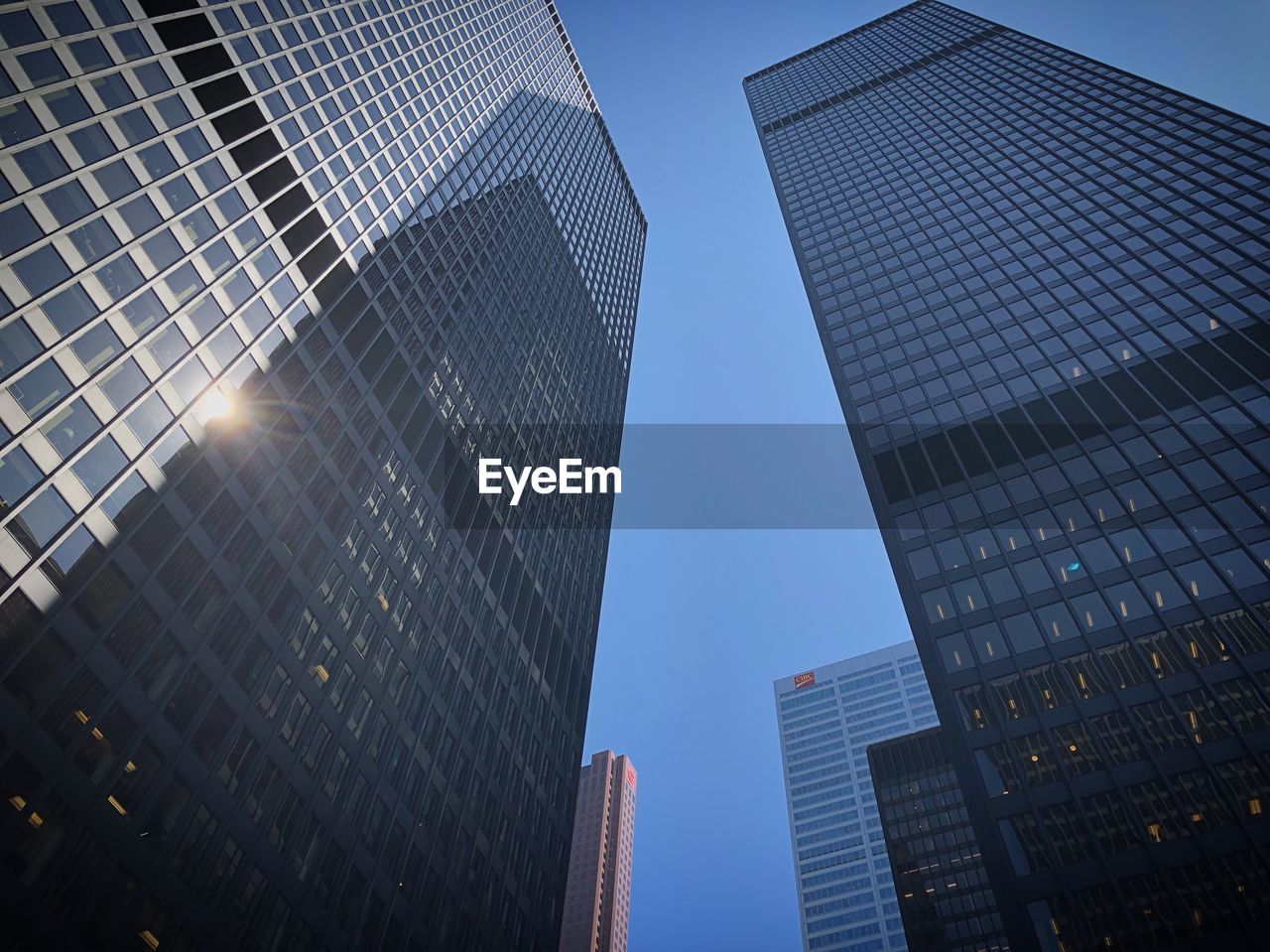 Low angle view of modern buildings against clear sky