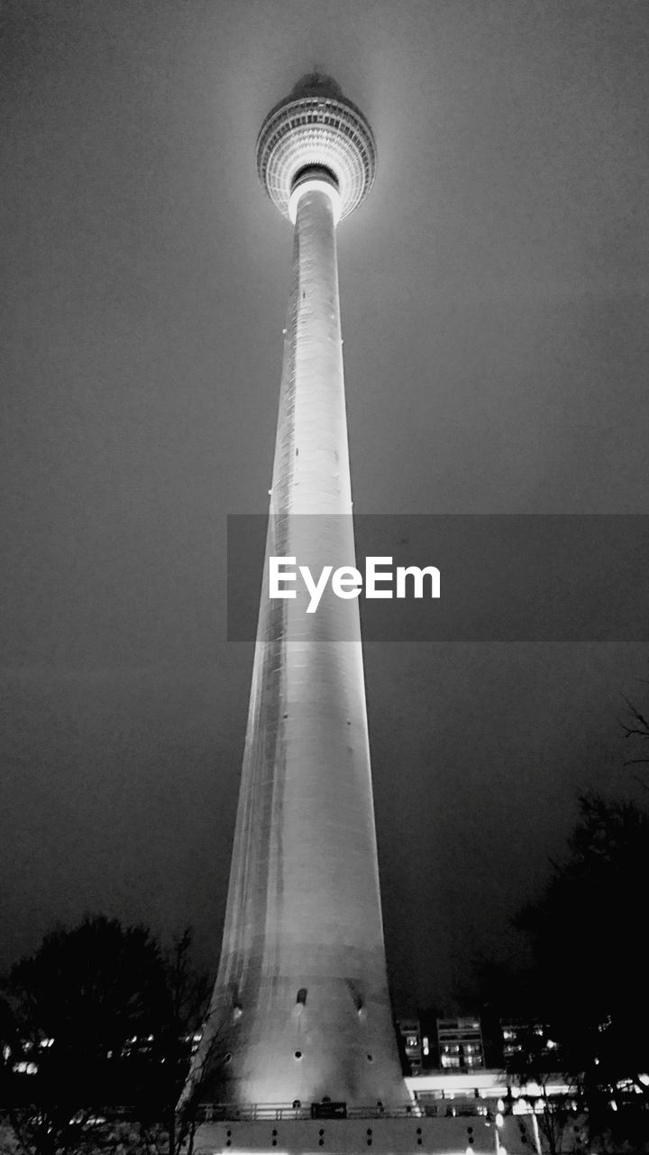 LOW ANGLE VIEW OF COMMUNICATIONS TOWER AGAINST SKY