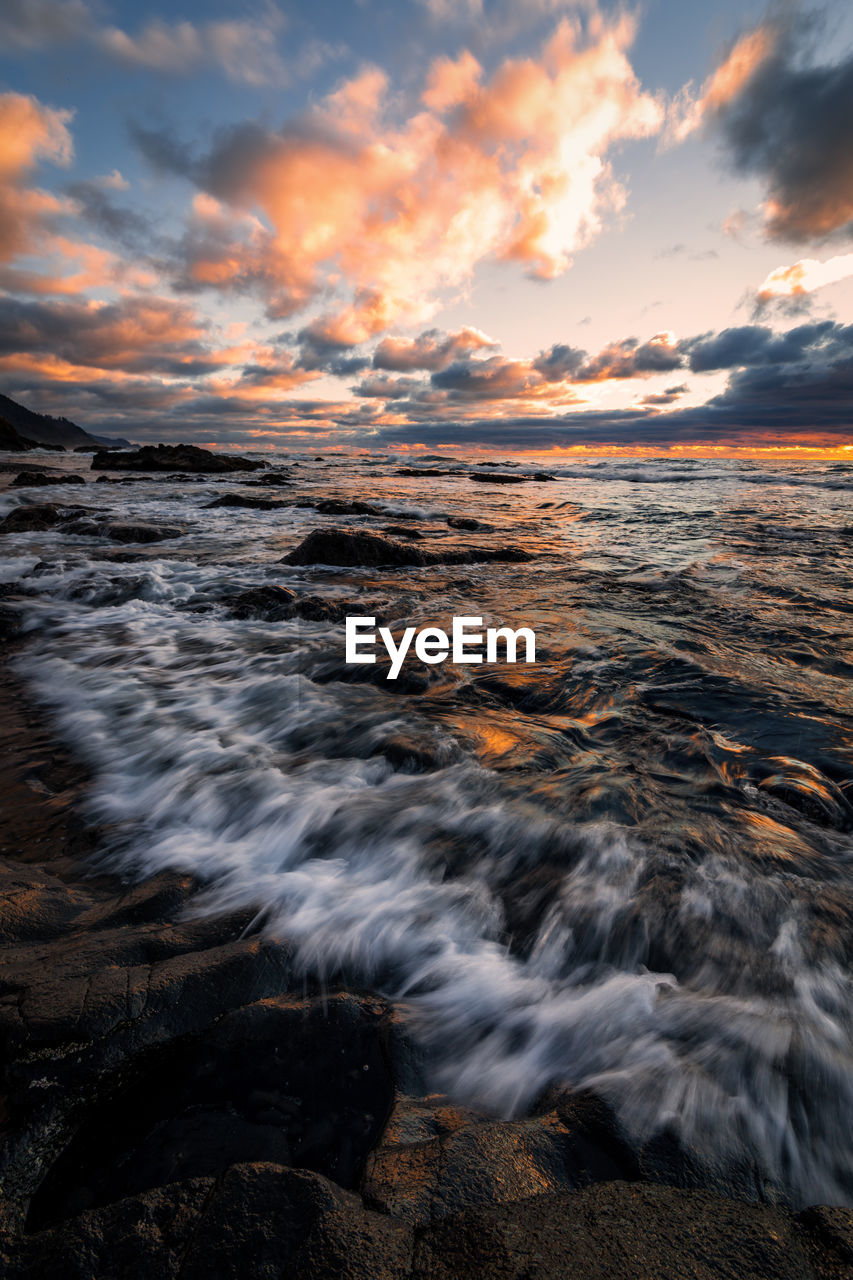 Scenic view of sea against sky during sunset