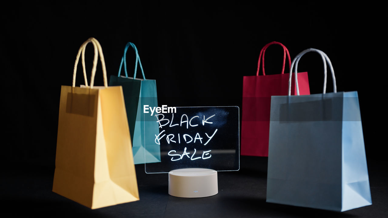 Shopping bags around black friday advertising