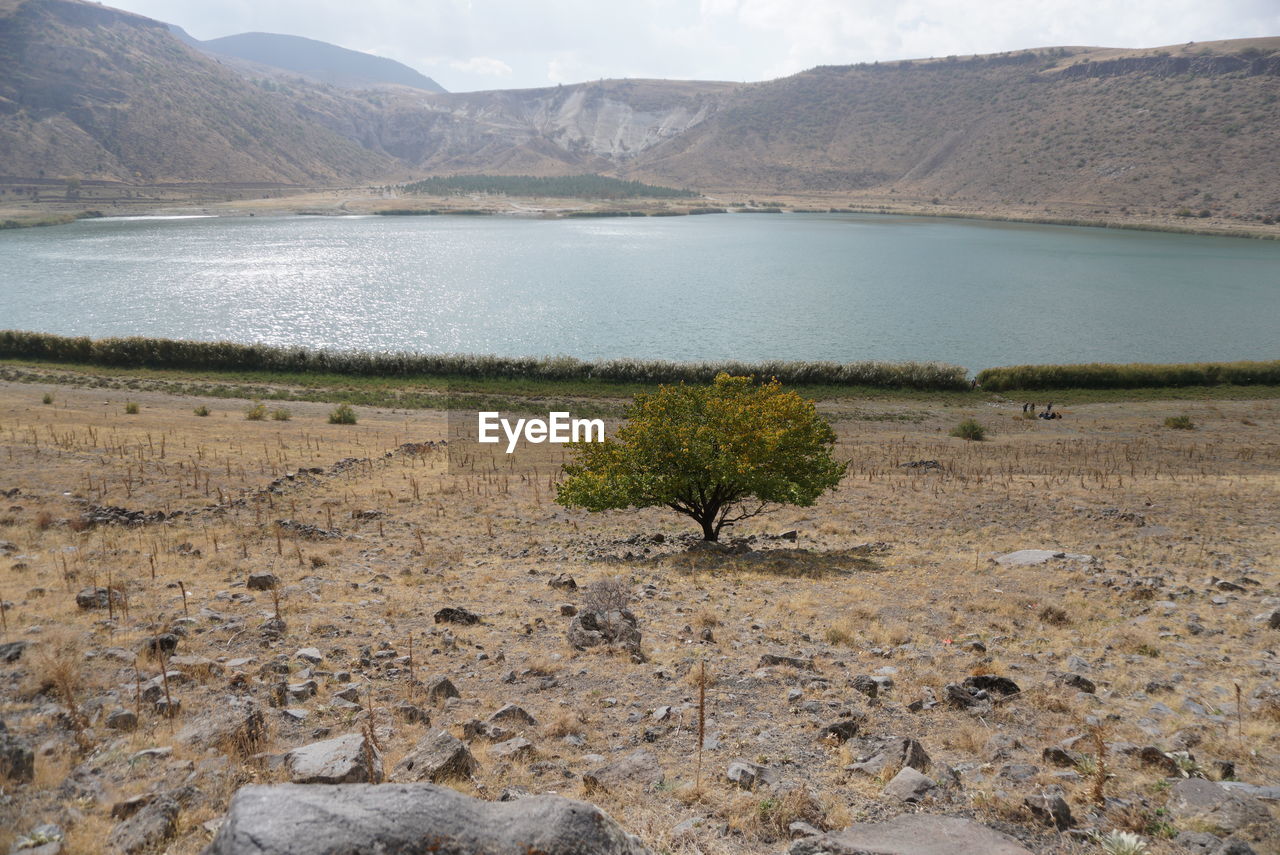 Scenic view of lake against mountain range