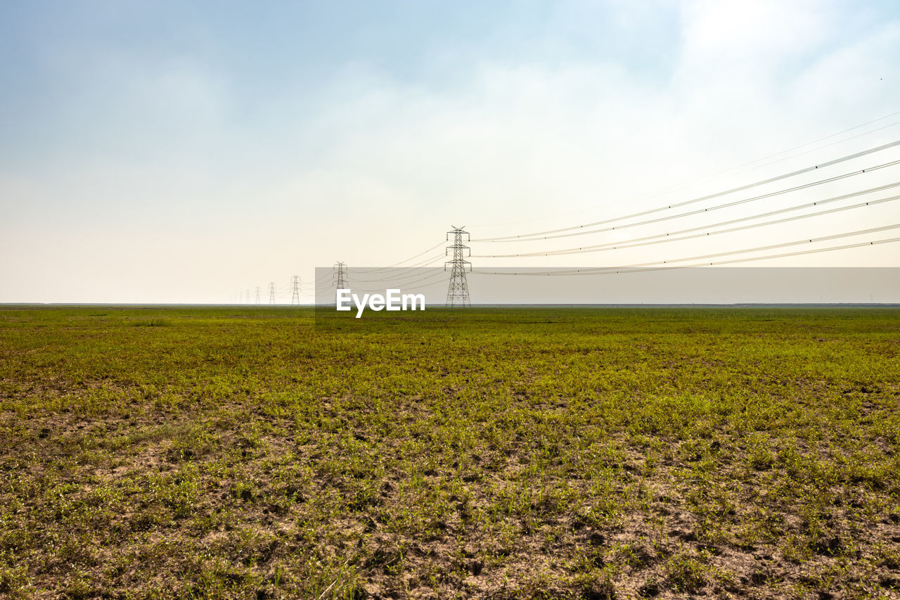 Scenic view of field against sky at morning