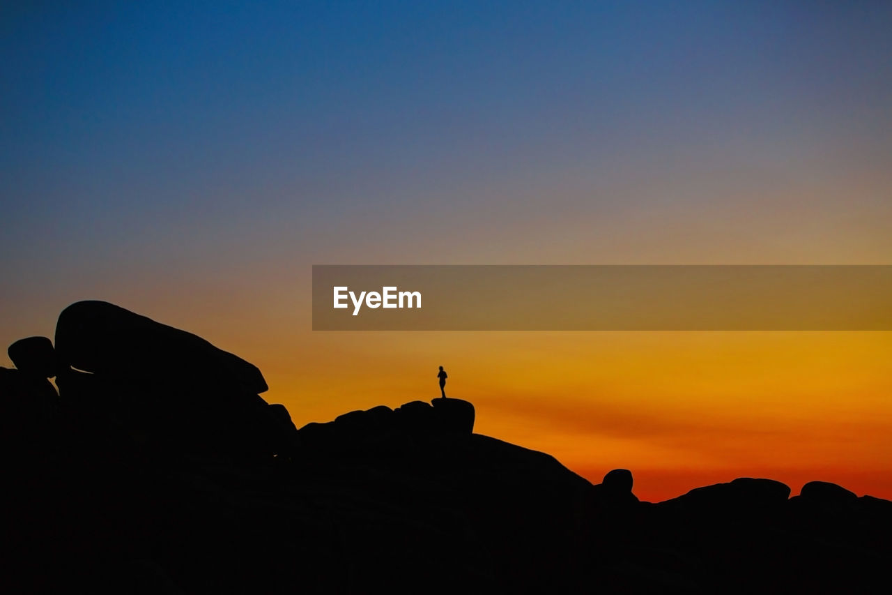 Human silhouette between cliffs-men ruz, brittany, france