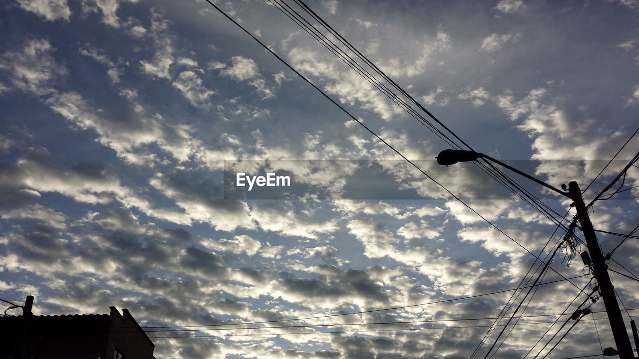 LOW ANGLE VIEW OF SKY AND CLOUDS IN SUNSET