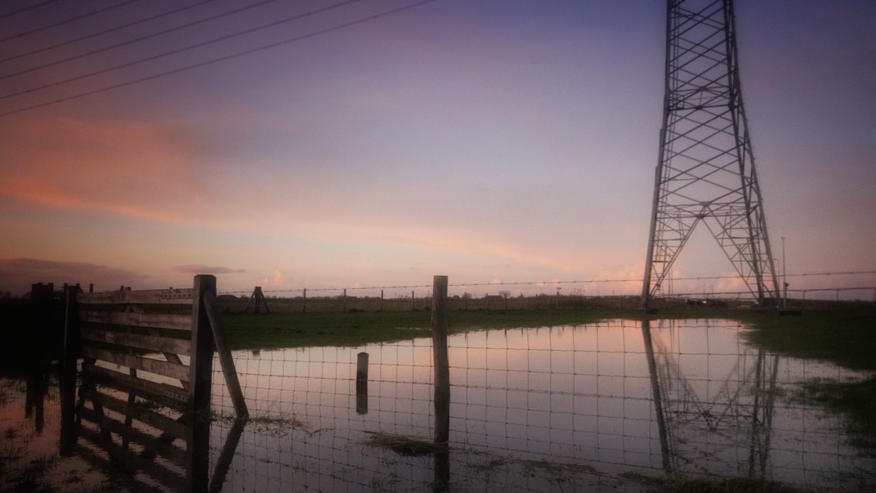 sunset, sky, safety, metal, no people, tranquility, electricity pylon, water, nature, scenics, outdoors, beauty in nature, landscape, day