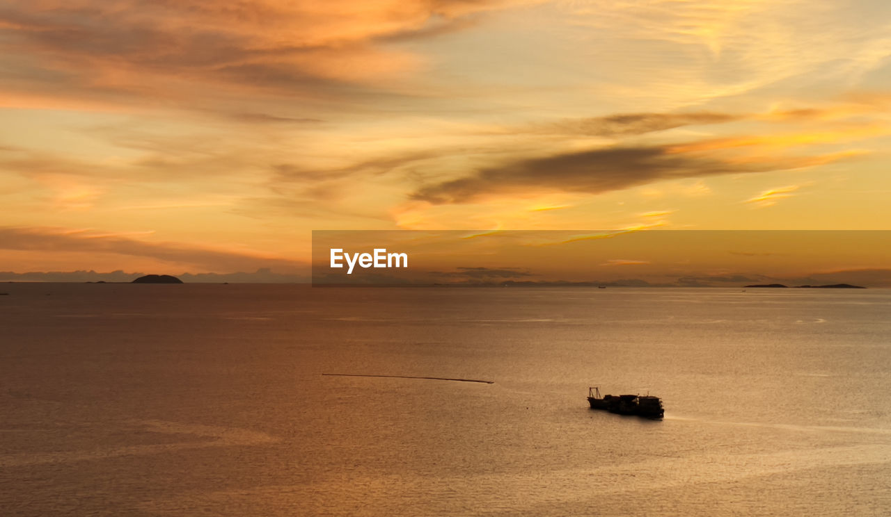 SCENIC VIEW OF SEA DURING SUNSET