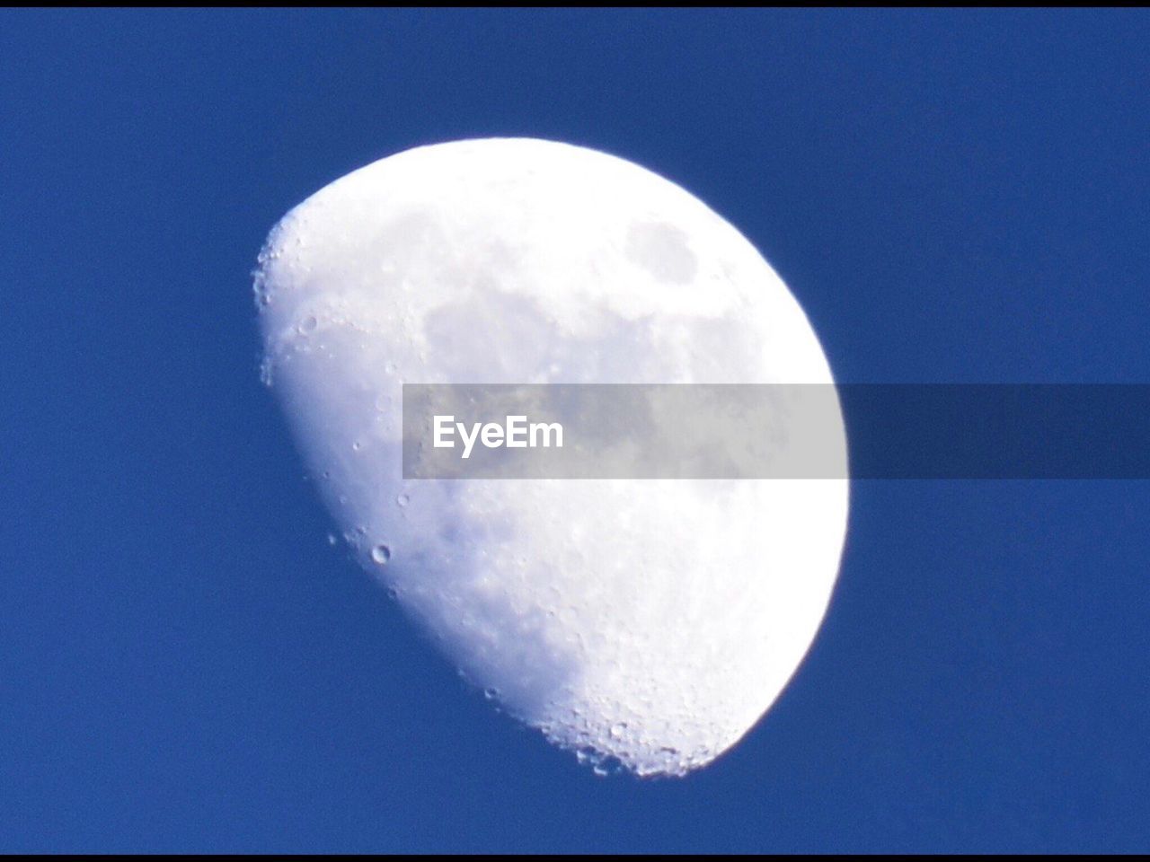 LOW ANGLE VIEW OF MOON IN SKY