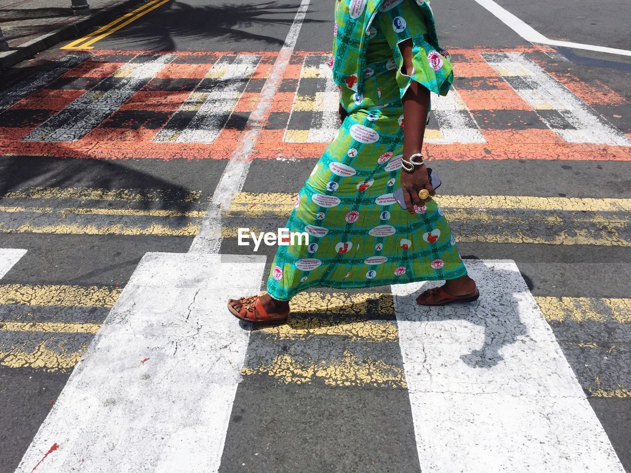 Low section of person walking on street