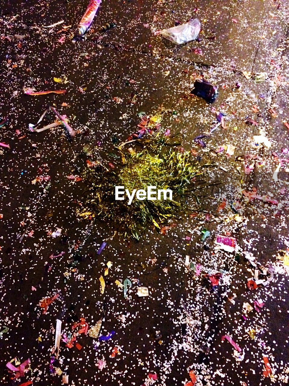 High angle view of confetti on street at night