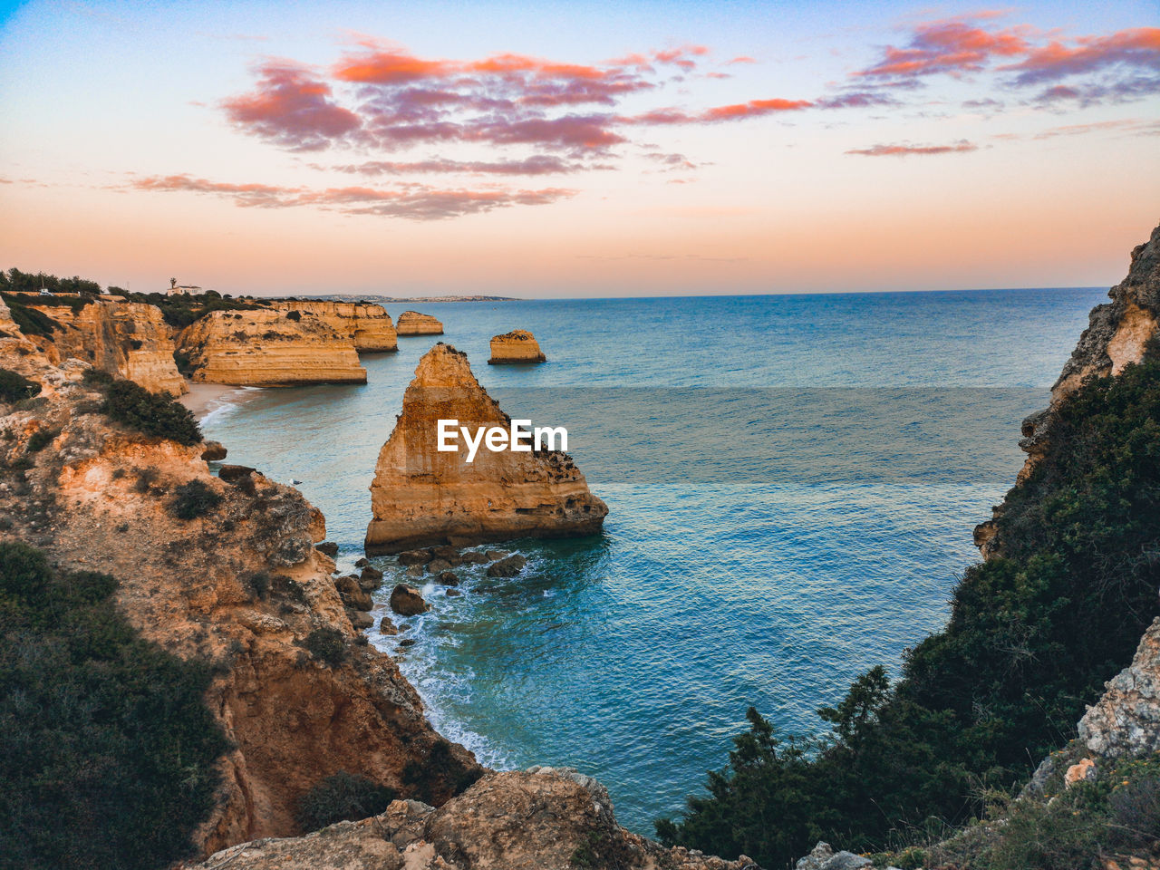 Scenic view of sea against sky during sunset