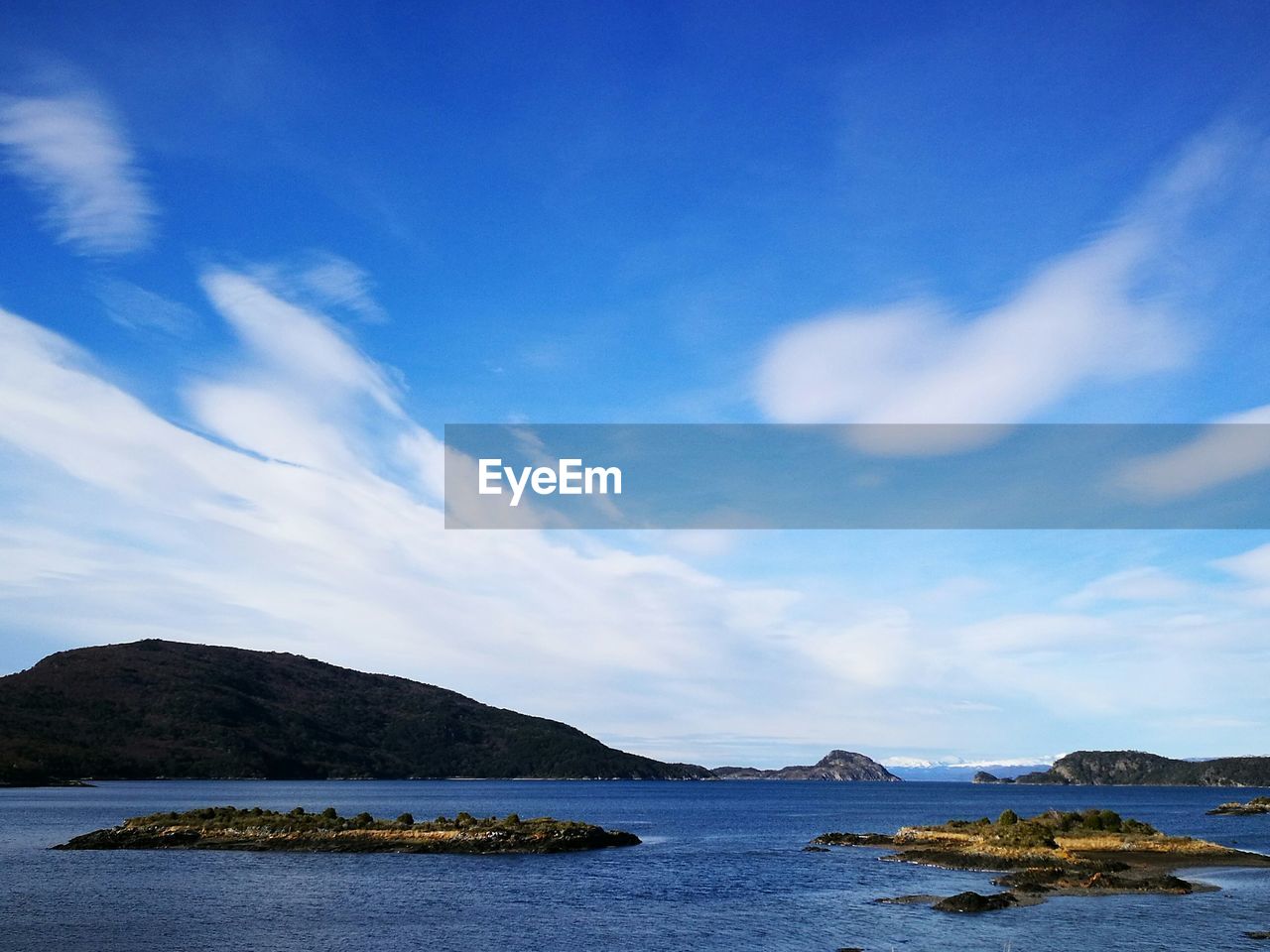 Scenic shot of calm lake against mountain range