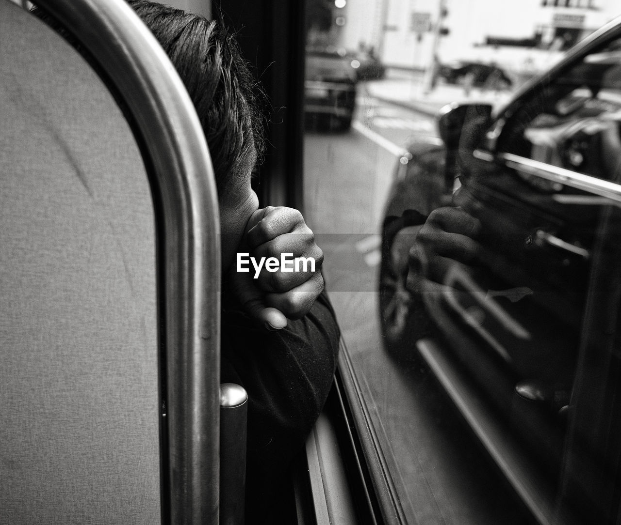 Man holding camera in bus