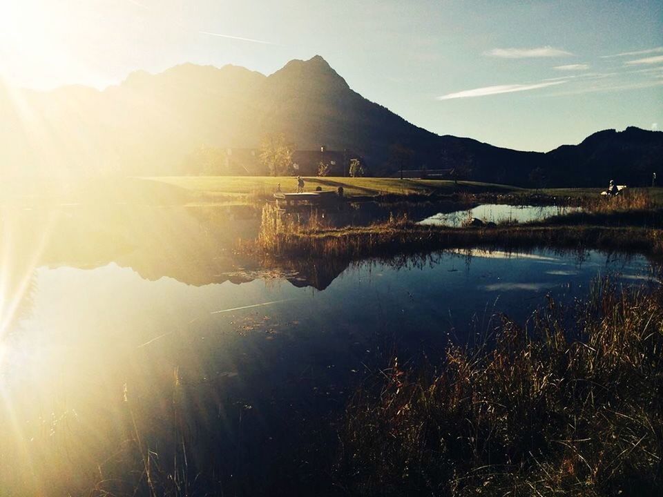 SCENIC VIEW OF LAKE AT SUNSET