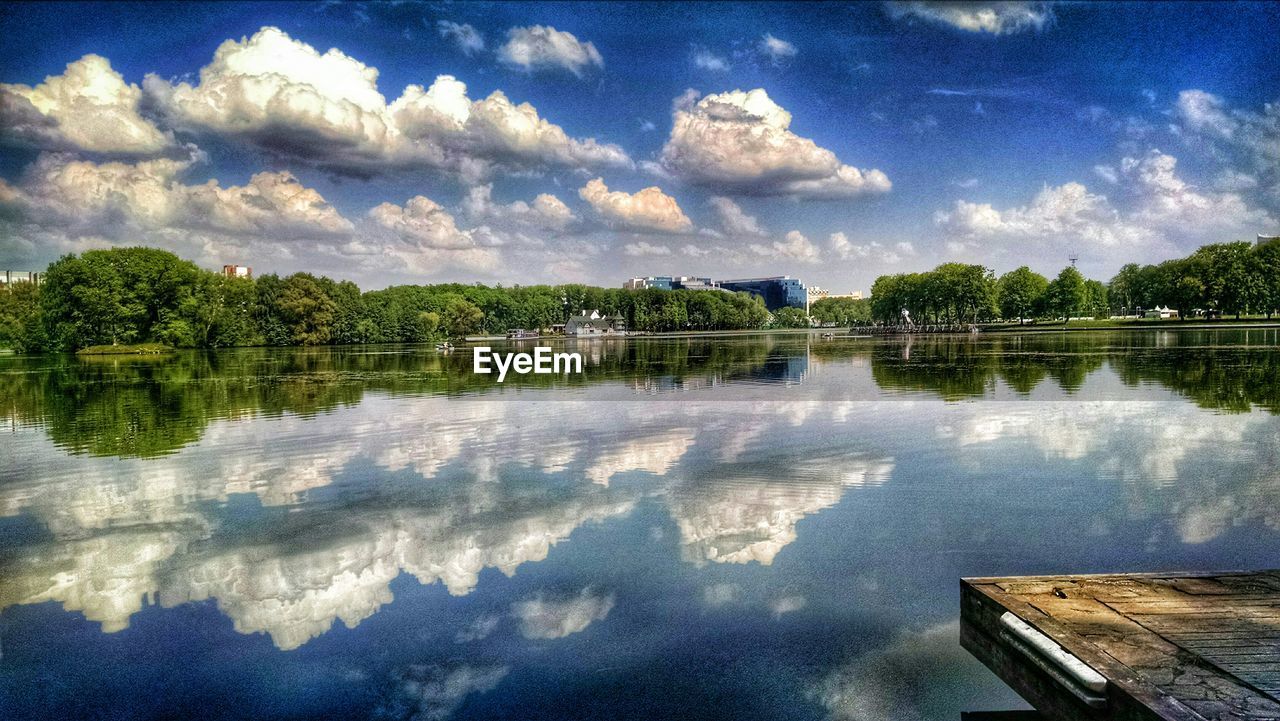 SCENIC VIEW OF LAKE AGAINST CLOUDY SKY