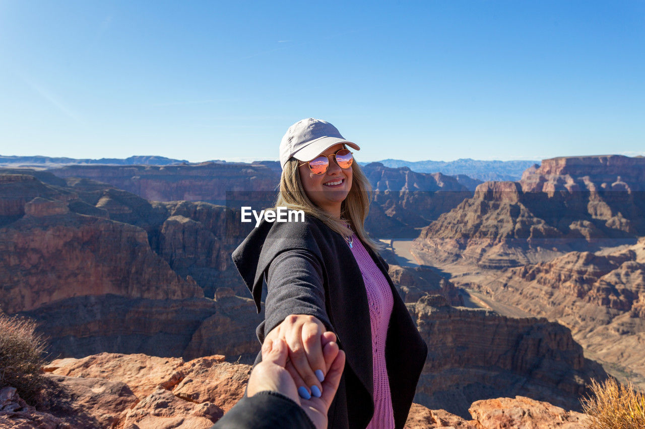 Portrait of girl standing on grand canyon