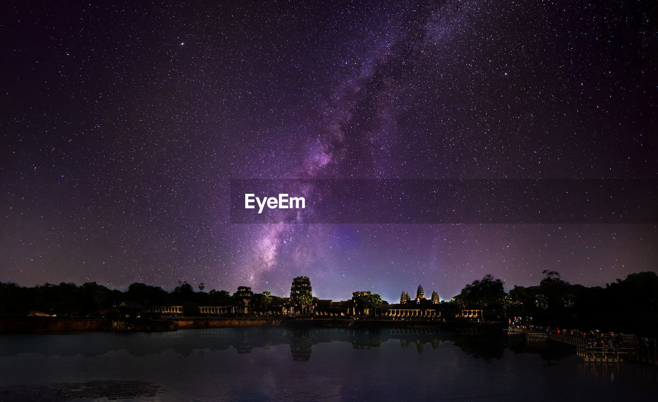 Scenic view of lake against star field at night